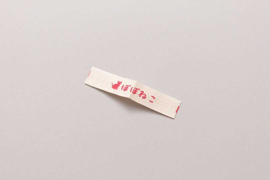 猫首輪のブランドネームタグの材質変更に関するお知らせ